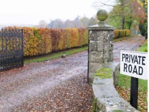Private road entrance for homes with private road access during a property survey in Roanoke, Alabama